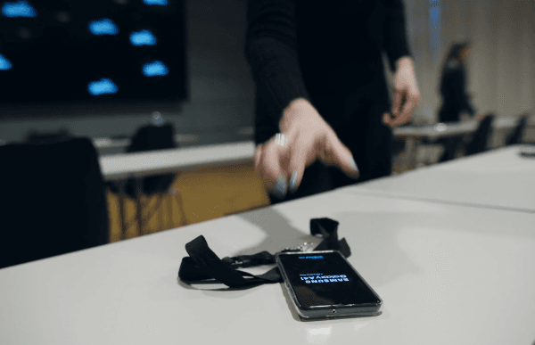 Hand reaching for a phone